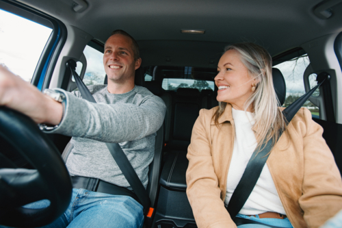 Man and woman travelling in a car together - Australian Stock Image