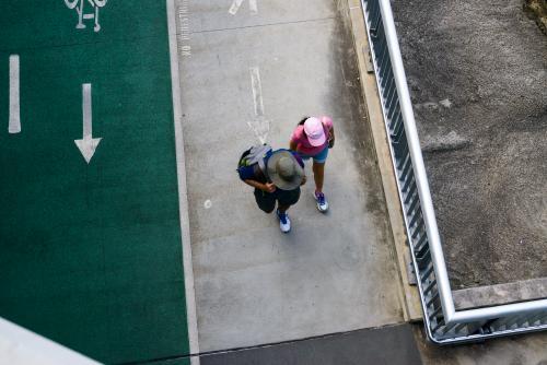 Man and woman walking on shared pathway - Australian Stock Image