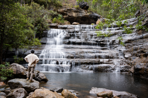 Man contemplating waterfalls in the blue mountains - Australian Stock Image
