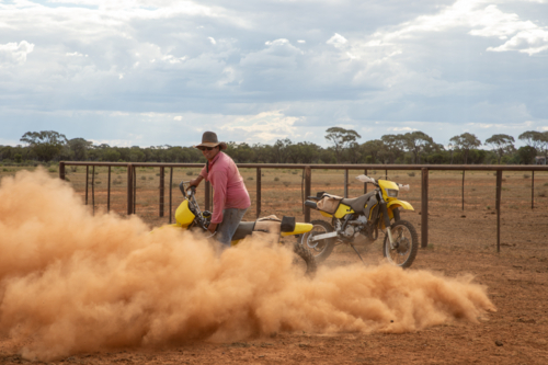 Man doing donuts on a dirt bike - Australian Stock Image