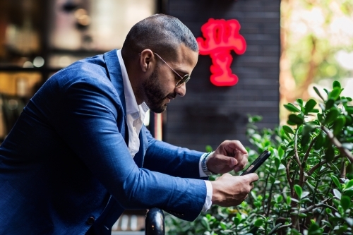 man in the city with phone - Australian Stock Image