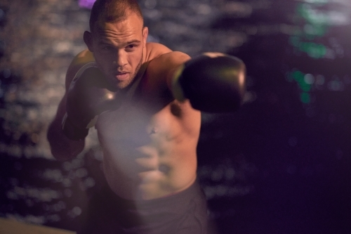 Man in urban city boxing fitness training - Australian Stock Image