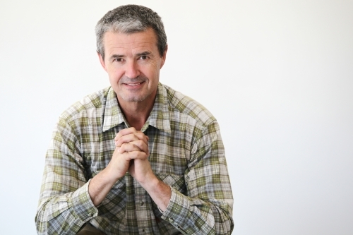 Man in work clothes on white - Australian Stock Image