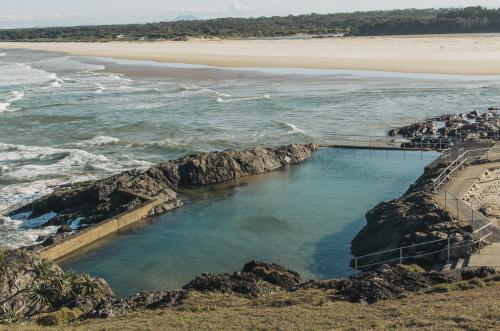 Man made swimming pool by ocean - Australian Stock Image