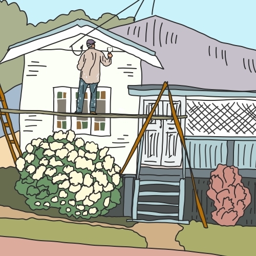 Man on scaffolding painting exterior of Queenslander house