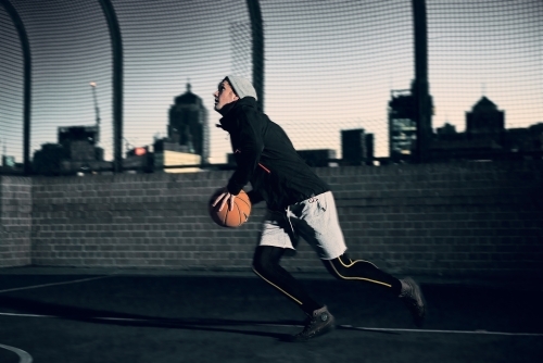 Man preparing to shoot basketball - Australian Stock Image