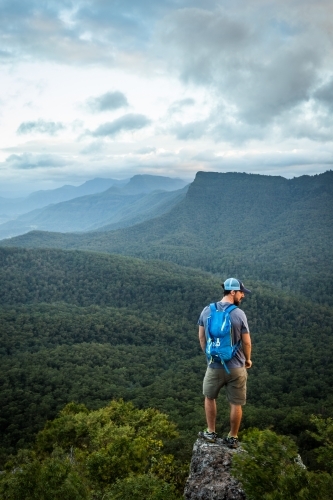 Man standing on Mountain top - Australian Stock Image