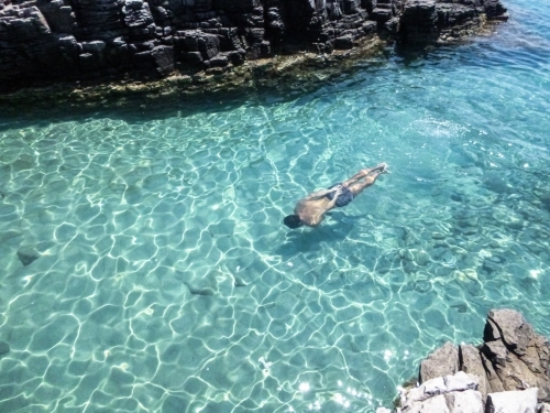 Man swimming underwater - Australian Stock Image
