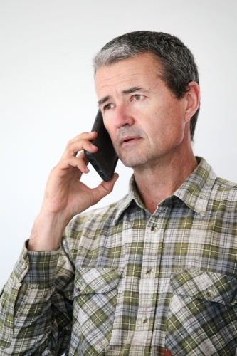Man talking on mobile phone - Australian Stock Image