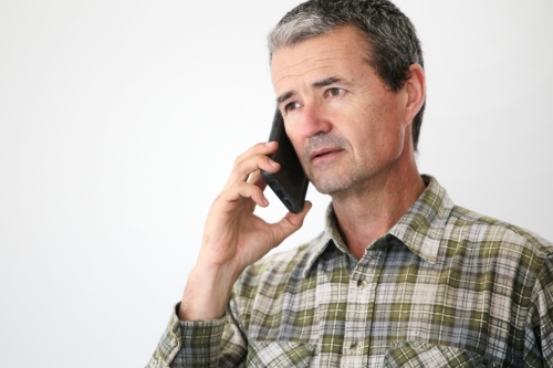 Man talking on mobile phone - Australian Stock Image