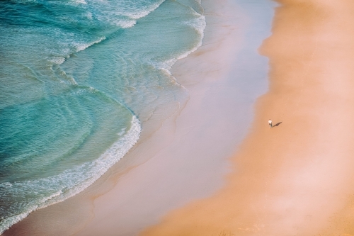 Man walking a deserted beach