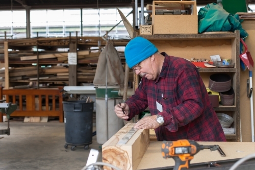 Man working at a Men's shed. - Australian Stock Image
