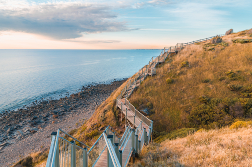 Marion to Hallett Cove Coastal Walking Trail with sea view at sunset, South Australia - Australian Stock Image