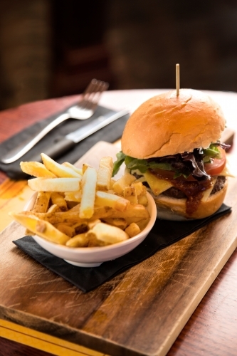 Meal of burger and fries in a cafe - Australian Stock Image