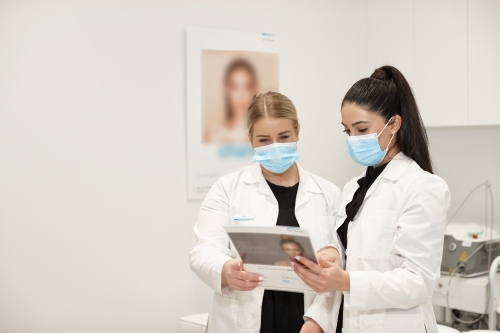 Medical practitioners working together at their practice - Australian Stock Image