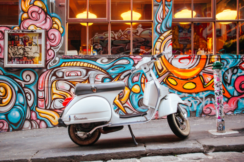 Melbourne's famous Hosier Lane with motorcycle and graffiti on the walls. - Australian Stock Image