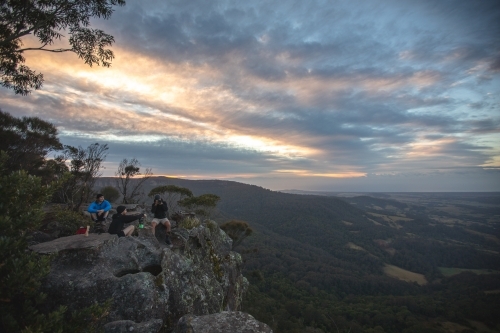 Men on cliff edge - Australian Stock Image