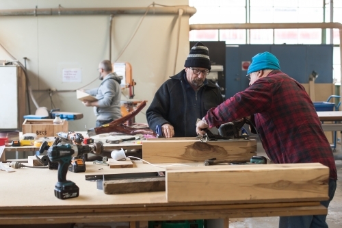 Men working on a project at a Men's Shed - Australian Stock Image