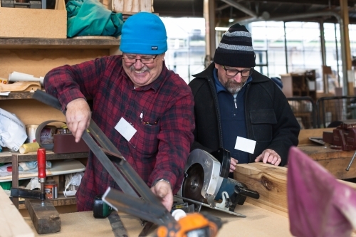 Men working on a project at a Men's Shed - Australian Stock Image