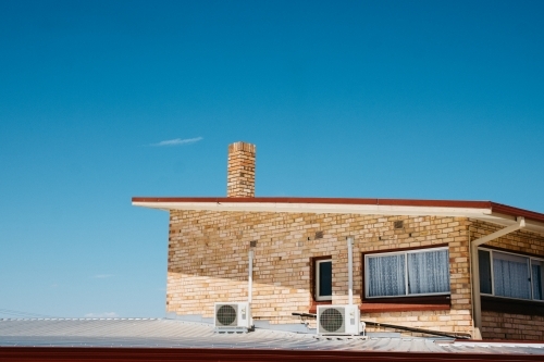 Mid-century home with roof extension - Australian Stock Image