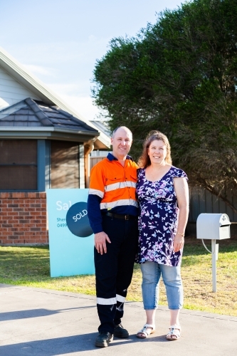 Middle aged couple buying first investment property - sold real estate - Australian Stock Image