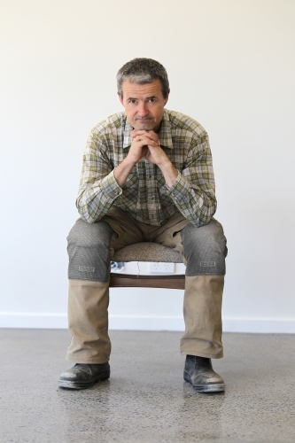 middle-aged man in work clothes - Australian Stock Image