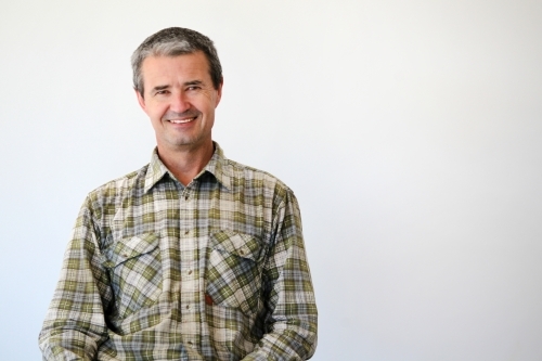middle-aged man in work clothes - Australian Stock Image