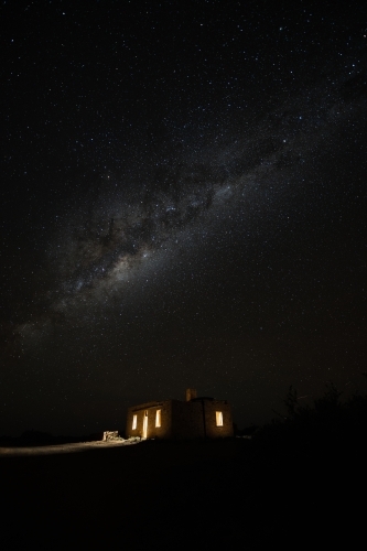 milky way over old stone building - Australian Stock Image