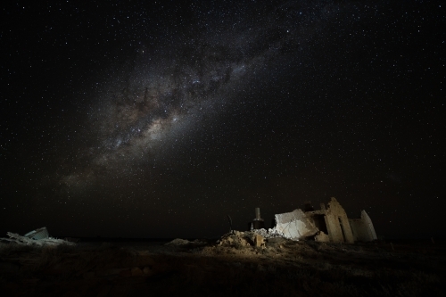 Milky Way over ruined stone building - Australian Stock Image