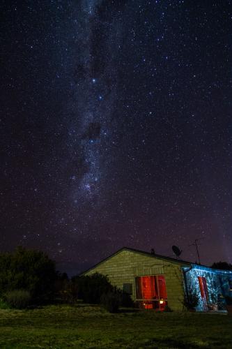 Milky Way Over Wood-Fire Glow - Australian Stock Image