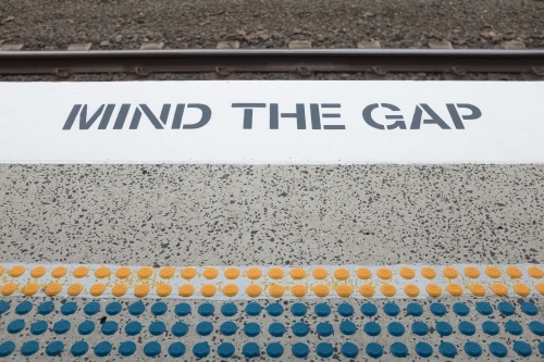 Mind the gap sign at a train station - Australian Stock Image