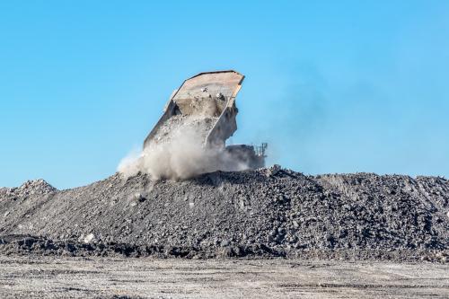 Mine dump truck dumping tailings