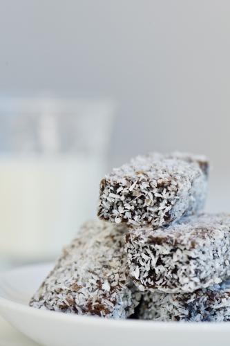 Mini lamingtons on a plate - Australian Stock Image