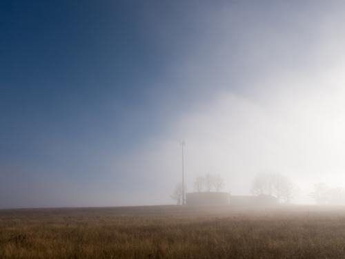 Mist clearing over reservoirs on a ridge