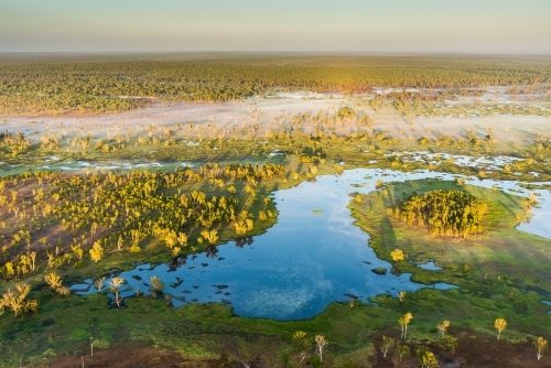 Mist rising over wetlands at sunrise - Australian Stock Image