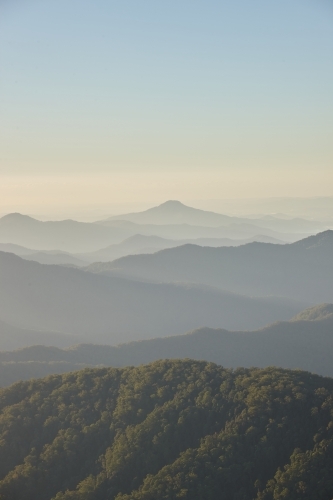 Misty mountain range during sunset - Australian Stock Image