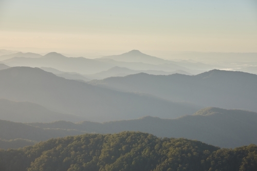 Misty mountain range during sunset - Australian Stock Image