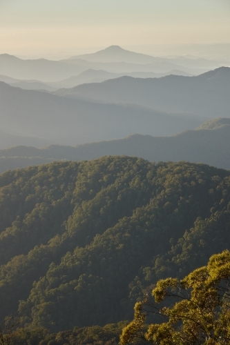 Misty mountain range during sunset - Australian Stock Image