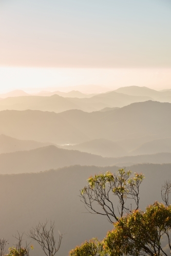 Misty mountain range during sunset - Australian Stock Image