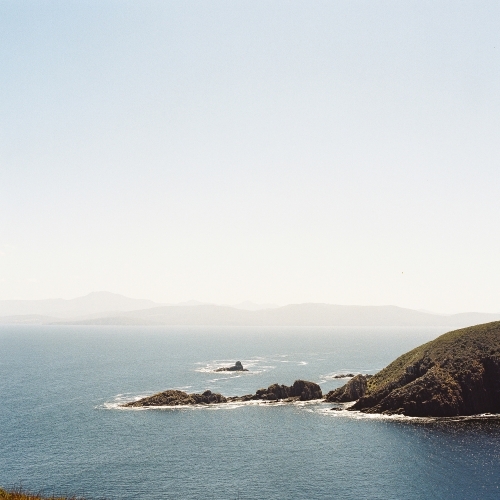 Misty Ocean Landscape with Rocky Outcrops - Australian Stock Image