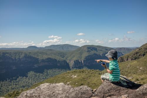 Mixed race boy bush walking in the Blue Mountains - Australian Stock Image