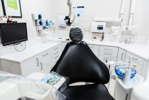 Modern dental treatment room with dental chair - Australian Stock Image