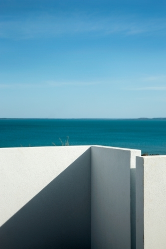 Modern outdoor courtyard with water views - Australian Stock Image