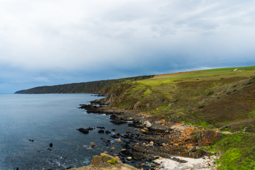 Moody Skies Over the Rugged Coastline at Kings Beach - Australian Stock Image