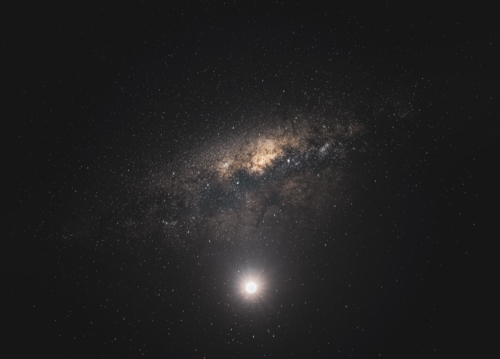 moon and milky way in dark sky - Australian Stock Image