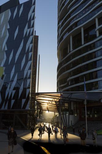 Morning commuters walking between two office towers