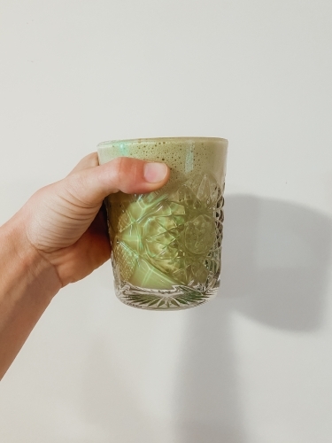Morning matcha latte in glass cup - Australian Stock Image