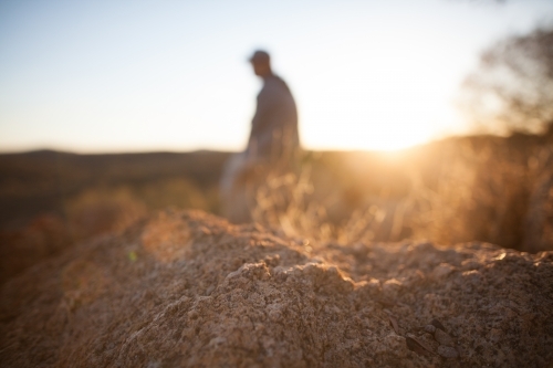 Morning sun flare over outback soil - Australian Stock Image