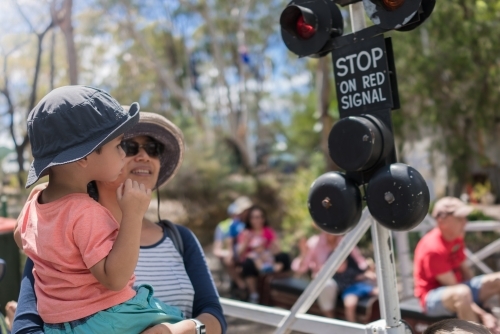 Mother and child watching miniature trains at Galston Trains, Hornsby Model Engineer's Club - Australian Stock Image