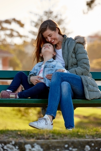 Mother and daughter bonding at park - Australian Stock Image